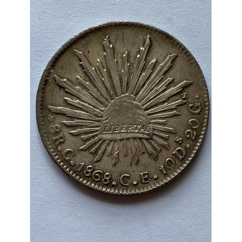 767 - A 19TH CENTURY MEXICAN LIBERTY 8 REALES COIN. A Mexican 8 Reales Coin dated 1868.  *CR:  slight wear... 