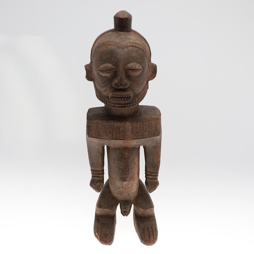 630 - LARGE AFRICAN TRIBAL FIGURE - DEMOCRATIC REPUBLIC OF CONGO. A large carved standing wooden figure, w... 