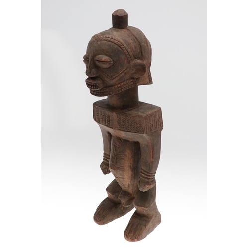 630 - LARGE AFRICAN TRIBAL FIGURE - DEMOCRATIC REPUBLIC OF CONGO. A large carved standing wooden figure, w... 