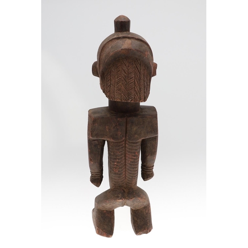 630 - LARGE AFRICAN TRIBAL FIGURE - DEMOCRATIC REPUBLIC OF CONGO. A large carved standing wooden figure, w... 