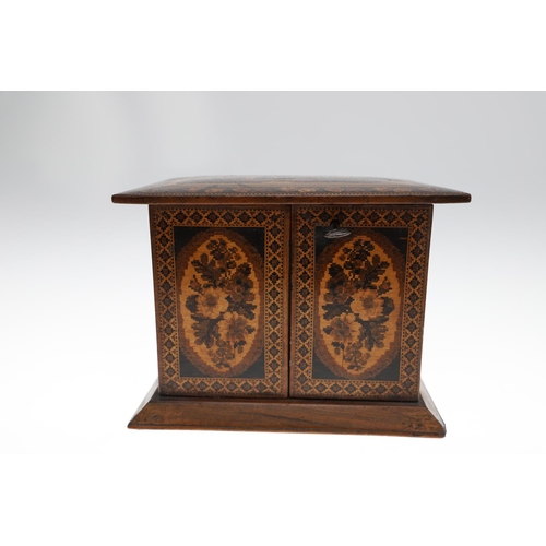 642 - VICTORIAN TUNBRIDGE WARE TABLE CABINET. A walnut and inlaid table cabinet, the lid with a depiction ... 