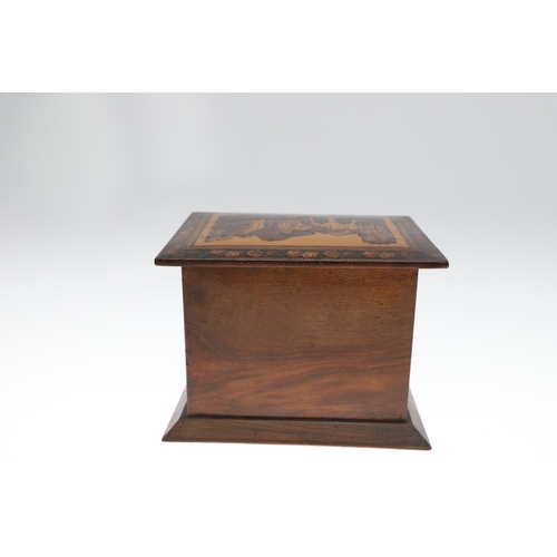 642 - VICTORIAN TUNBRIDGE WARE TABLE CABINET. A walnut and inlaid table cabinet, the lid with a depiction ... 