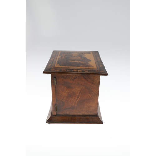 642 - VICTORIAN TUNBRIDGE WARE TABLE CABINET. A walnut and inlaid table cabinet, the lid with a depiction ... 