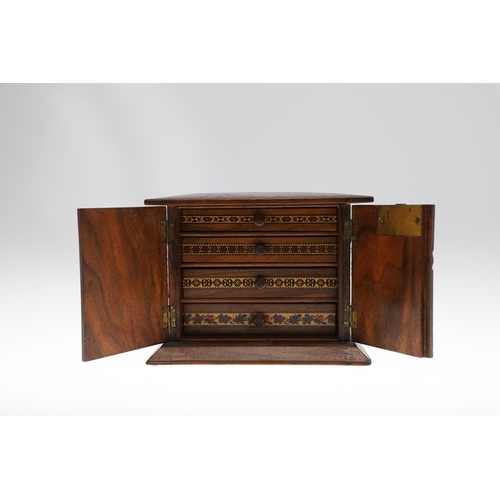 642 - VICTORIAN TUNBRIDGE WARE TABLE CABINET. A walnut and inlaid table cabinet, the lid with a depiction ... 