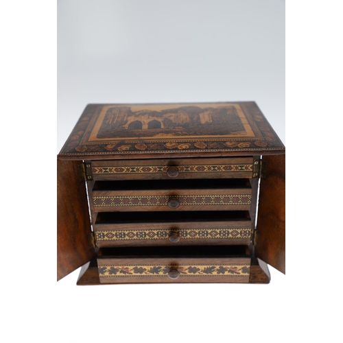 642 - VICTORIAN TUNBRIDGE WARE TABLE CABINET. A walnut and inlaid table cabinet, the lid with a depiction ... 