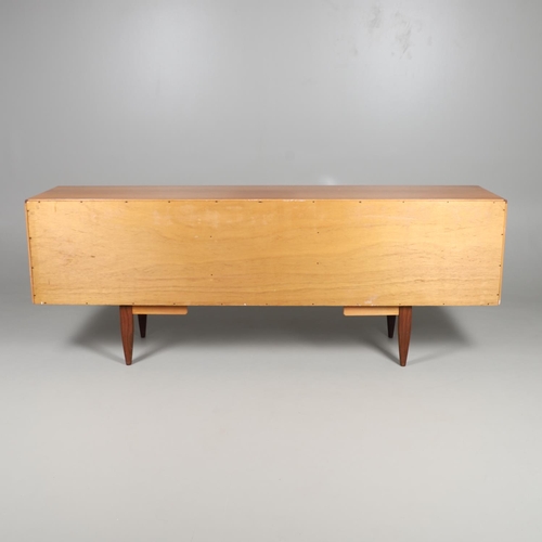 671 - G-PLAN - A LARGE TEAK MID CENTURY SIDEBOARD. A large G-Plan sideboard with four central drawers flan... 