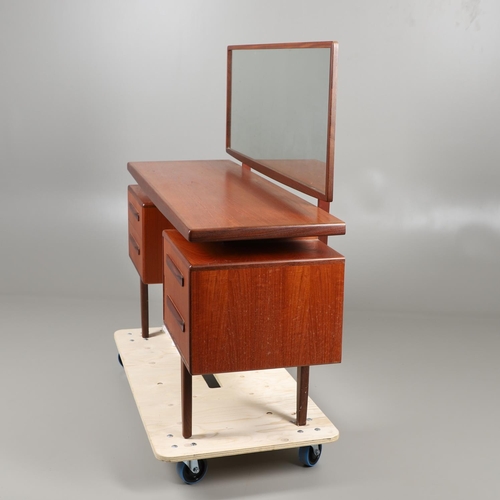 674 - A MID CENTURY G-PLAN TEAK DRESSING TABLE AND MATCHING CHEST OF DRAWERS. The dressing table with two ... 