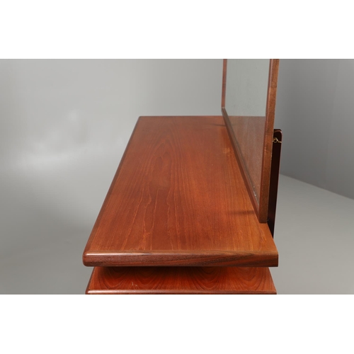 674 - A MID CENTURY G-PLAN TEAK DRESSING TABLE AND MATCHING CHEST OF DRAWERS. The dressing table with two ... 