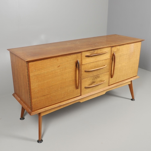 675 - A MID CENTURY TEAK SIDEBOARD & DINING TABLE - HANDCRAFT. With three central drawers flanked by two c... 