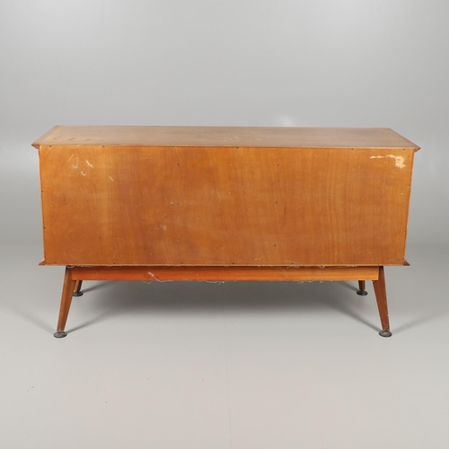 675 - A MID CENTURY TEAK SIDEBOARD & DINING TABLE - HANDCRAFT. With three central drawers flanked by two c... 