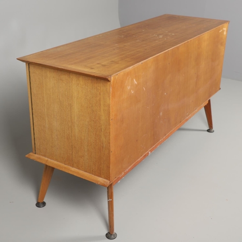 675 - A MID CENTURY TEAK SIDEBOARD & DINING TABLE - HANDCRAFT. With three central drawers flanked by two c... 