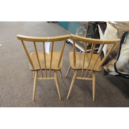 676 - VINTAGE ERCOL SIDE TABLE AND TWO DINING CHAIRS. An elm and beech side table of rectangular shape wit... 