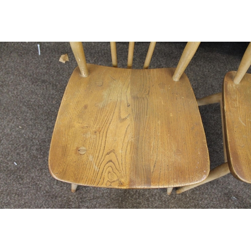 676 - VINTAGE ERCOL SIDE TABLE AND TWO DINING CHAIRS. An elm and beech side table of rectangular shape wit... 