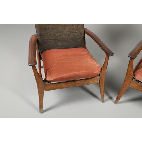 678 - A PAIR OF MID CENTURY ARMCHAIRS - FURPRO. A pair of teak chairs with wide arms and splayed legs, the... 