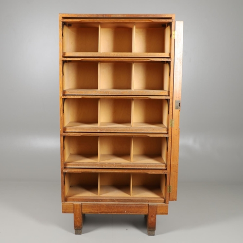 683 - A 'STAVERTON' LIGHT OAK BOOKCASE. In the Globe Wernicke style with pigeon hole compartments, stamped... 