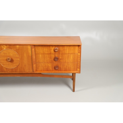 684 - MID CENTURY TEAK SIDEBOARD. A large sideboard with two cupboard doors with circular panels and inter... 