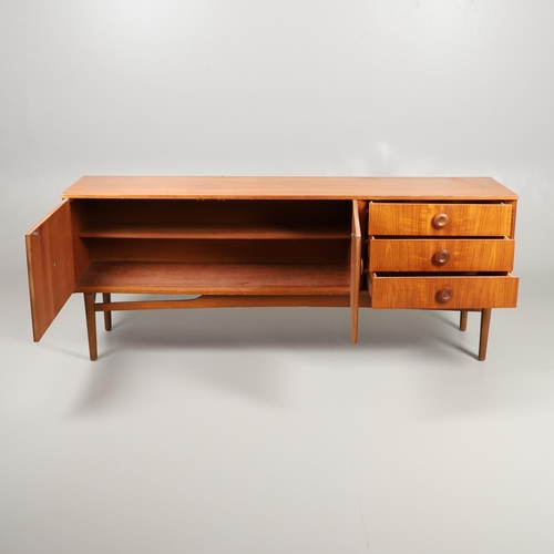 684 - MID CENTURY TEAK SIDEBOARD. A large sideboard with two cupboard doors with circular panels and inter... 