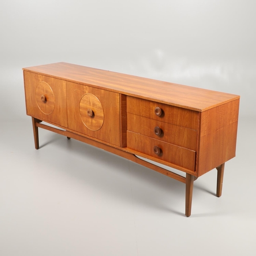 684 - MID CENTURY TEAK SIDEBOARD. A large sideboard with two cupboard doors with circular panels and inter... 