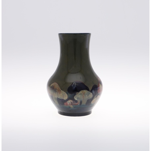 691 - ANTIQUE MOORCROFT VASE - CLAREMONT. The vase of bulbous form, painted in the Claremont design on a g... 