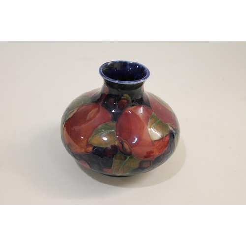 692 - ANTIQUE MOORCROFT BOWL ON THREE FEET, & SMALL MOORCROFT VASE - POMEGRANATE. A Moorcroft bowl support... 