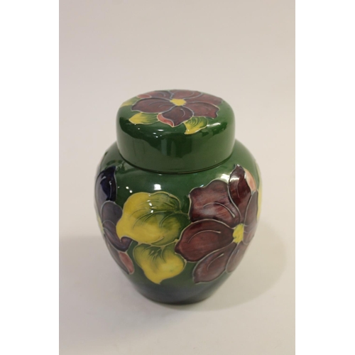 699 - MOORCROFT LIDDED JAR - SPRING FLOWERS, & A LIDDED GINGER JAR. A lidded Moorcroft jar in the Spring F... 