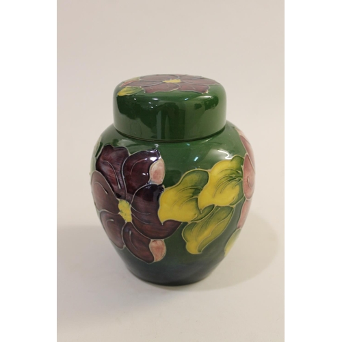 699 - MOORCROFT LIDDED JAR - SPRING FLOWERS, & A LIDDED GINGER JAR. A lidded Moorcroft jar in the Spring F... 