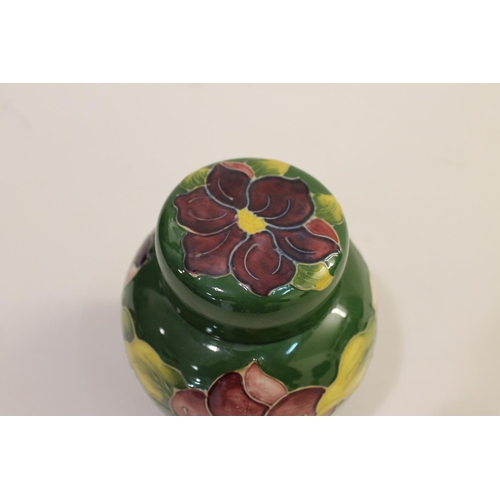 699 - MOORCROFT LIDDED JAR - SPRING FLOWERS, & A LIDDED GINGER JAR. A lidded Moorcroft jar in the Spring F... 