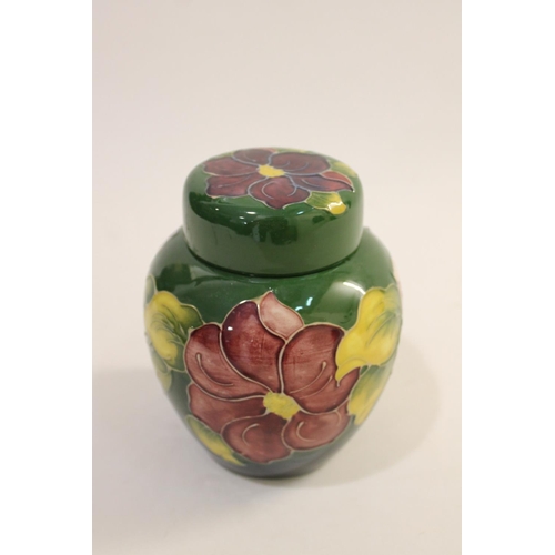 699 - MOORCROFT LIDDED JAR - SPRING FLOWERS, & A LIDDED GINGER JAR. A lidded Moorcroft jar in the Spring F... 