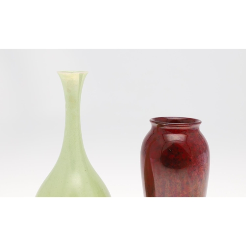 700 - MOORCROFT HIGH FIRED FLAMBE VASE & ANOTHER VASE. A slender tapering vase with a high fired flambe gl... 