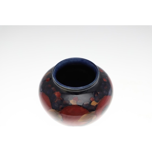 719 - ANTIQUE MOORCROFT BOWL - POMEGRANATE. A globular shaped bowl, painted in the Pomegranate design on a... 