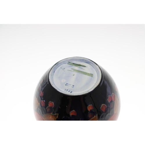 719 - ANTIQUE MOORCROFT BOWL - POMEGRANATE. A globular shaped bowl, painted in the Pomegranate design on a... 