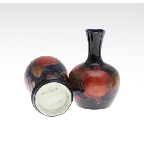 722 - MOORCROFT MINIATURE VASES - POMEGRANATE. Including a miniature baluster shaped vase painted in the P... 