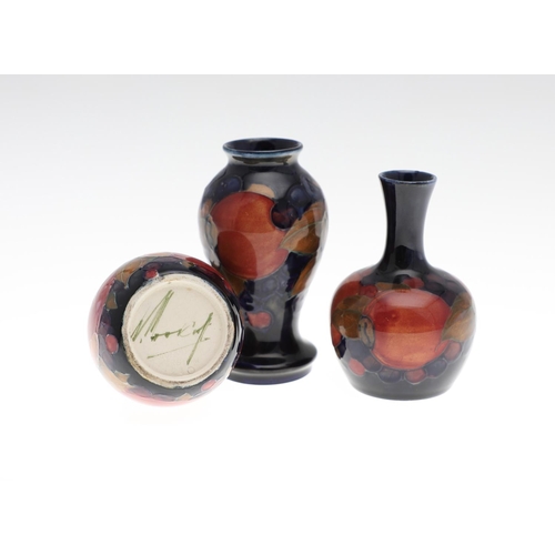 722 - MOORCROFT MINIATURE VASES - POMEGRANATE. Including a miniature baluster shaped vase painted in the P... 