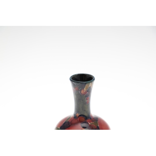 722 - MOORCROFT MINIATURE VASES - POMEGRANATE. Including a miniature baluster shaped vase painted in the P... 