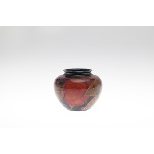 724 - SMALL ANTIQUE MOORCROFT VASE & SMALL POT - POMEGRANATE. A small vase painted in the Pomegranate desi... 