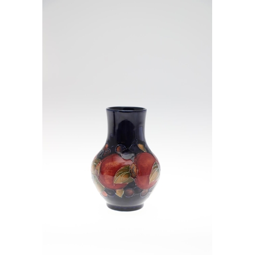 724 - SMALL ANTIQUE MOORCROFT VASE & SMALL POT - POMEGRANATE. A small vase painted in the Pomegranate desi... 