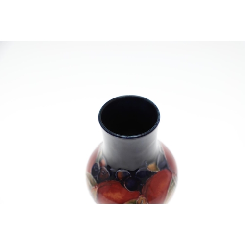 724 - SMALL ANTIQUE MOORCROFT VASE & SMALL POT - POMEGRANATE. A small vase painted in the Pomegranate desi... 