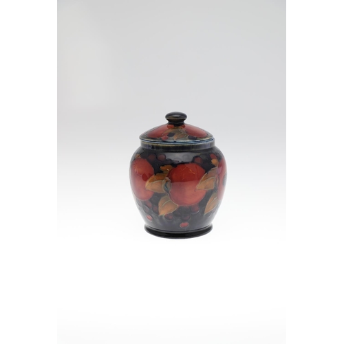 726 - MOORCROFT LIDDED JAR, & THREE OTHER LIDDED JARS. An ovoid lidded jar in the Pomegranate design, 15cm... 