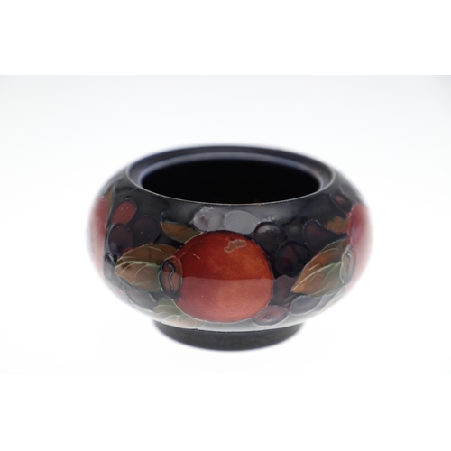 726 - MOORCROFT LIDDED JAR, & THREE OTHER LIDDED JARS. An ovoid lidded jar in the Pomegranate design, 15cm... 