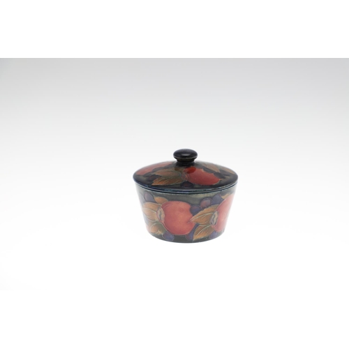 726 - MOORCROFT LIDDED JAR, & THREE OTHER LIDDED JARS. An ovoid lidded jar in the Pomegranate design, 15cm... 