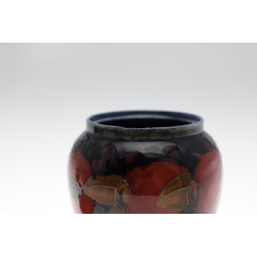 726 - MOORCROFT LIDDED JAR, & THREE OTHER LIDDED JARS. An ovoid lidded jar in the Pomegranate design, 15cm... 