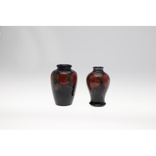 727 - TWO ANTIQUE MOORCROFT VASES - POMEGRANATE. Including a baluster shaped vase, painted in the Pomegran... 