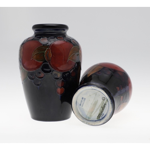 727 - TWO ANTIQUE MOORCROFT VASES - POMEGRANATE. Including a baluster shaped vase, painted in the Pomegran... 