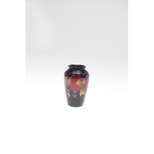 728 - MINIATURE ANTIQUE MOORCROFT VASES. Three various miniature vases, each painted in the Pomegranate de... 