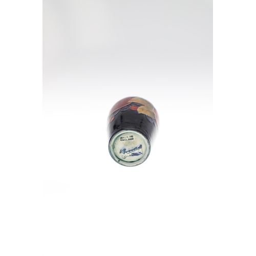 728 - MINIATURE ANTIQUE MOORCROFT VASES. Three various miniature vases, each painted in the Pomegranate de... 