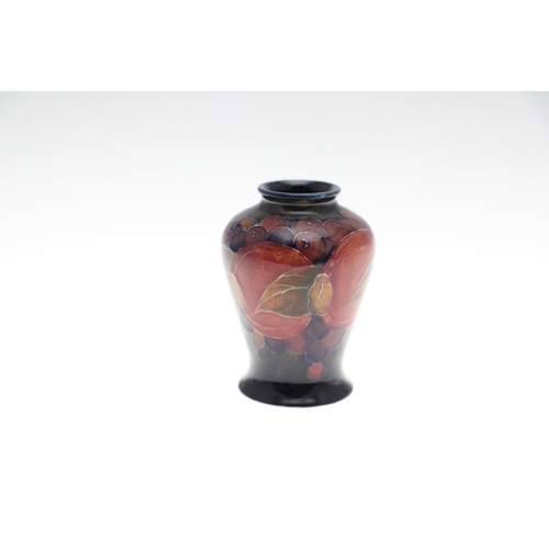 728 - MINIATURE ANTIQUE MOORCROFT VASES. Three various miniature vases, each painted in the Pomegranate de... 