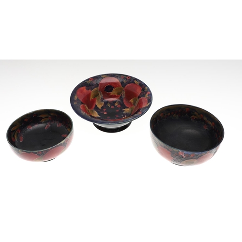 730 - THREE ANTIQUE MOORCROFT LARGE BOWLS - POMEGRANATE. Including a large pedestal bowl painted to the in... 