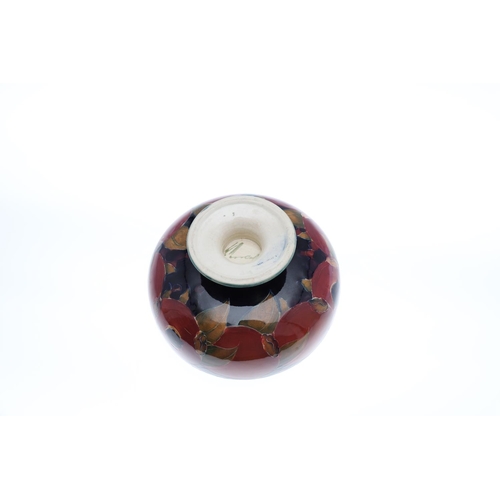 730 - THREE ANTIQUE MOORCROFT LARGE BOWLS - POMEGRANATE. Including a large pedestal bowl painted to the in... 