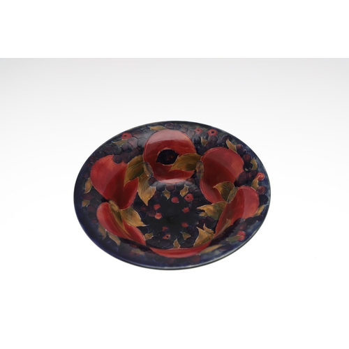 730 - THREE ANTIQUE MOORCROFT LARGE BOWLS - POMEGRANATE. Including a large pedestal bowl painted to the in... 