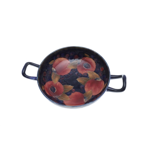 732 - ANTIQUE MOORCROFT TWO HANDLED BOWL, & OTHER ITEMS. A two handled bowl painted in the Pomegranate des... 